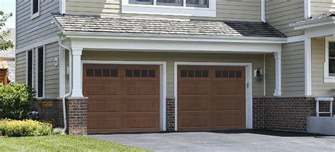 These carriage house <b>garage</b> <b>doors</b> offer embossed, high tensile steel panels that give the look of wood with the strength of steel. . Newport 200 garage door